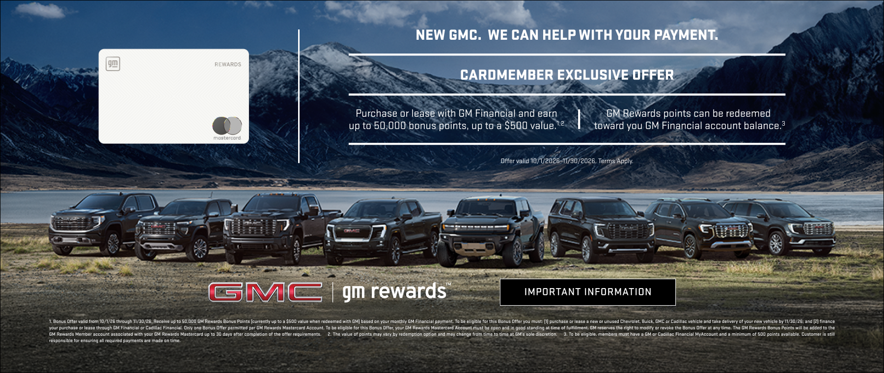 Line up of GMC vehicles in front of lake & mountains